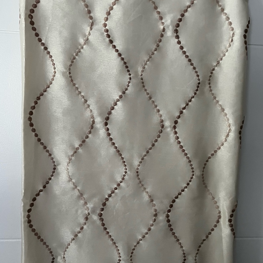 Set of 4 grommet curtain panels in Elegant Cream and Brown wave detail. Lined.